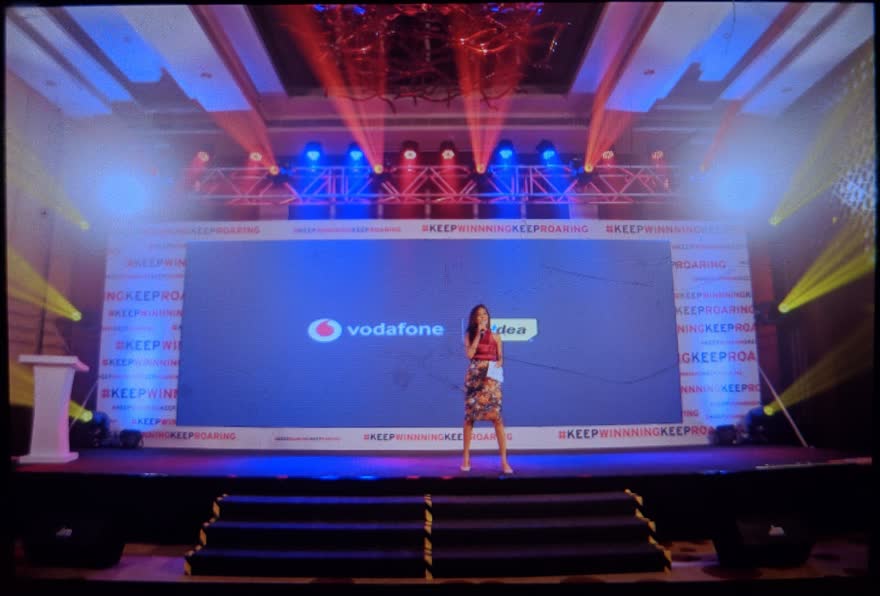 Dhwani Rao presenting on a corporate stage